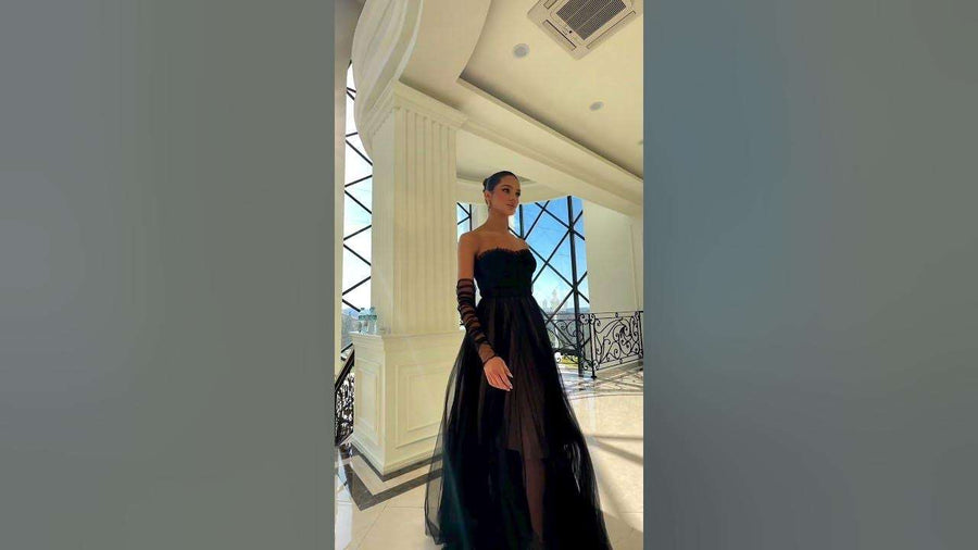 NC1064 Strapless Tulle Gown in black and nude with sweetheart neckline, sheer corset bodice, and full A-line tulle skirt, styled with mesh gloves.