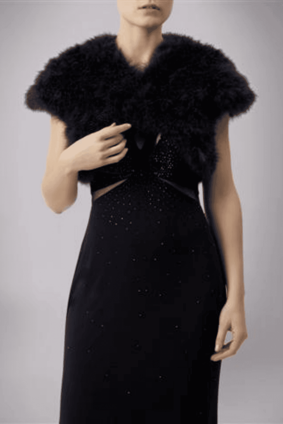 Black Feather Shrug FK042 by Mascara London paired with a black embellished gown, perfect for formal or gala occasions.