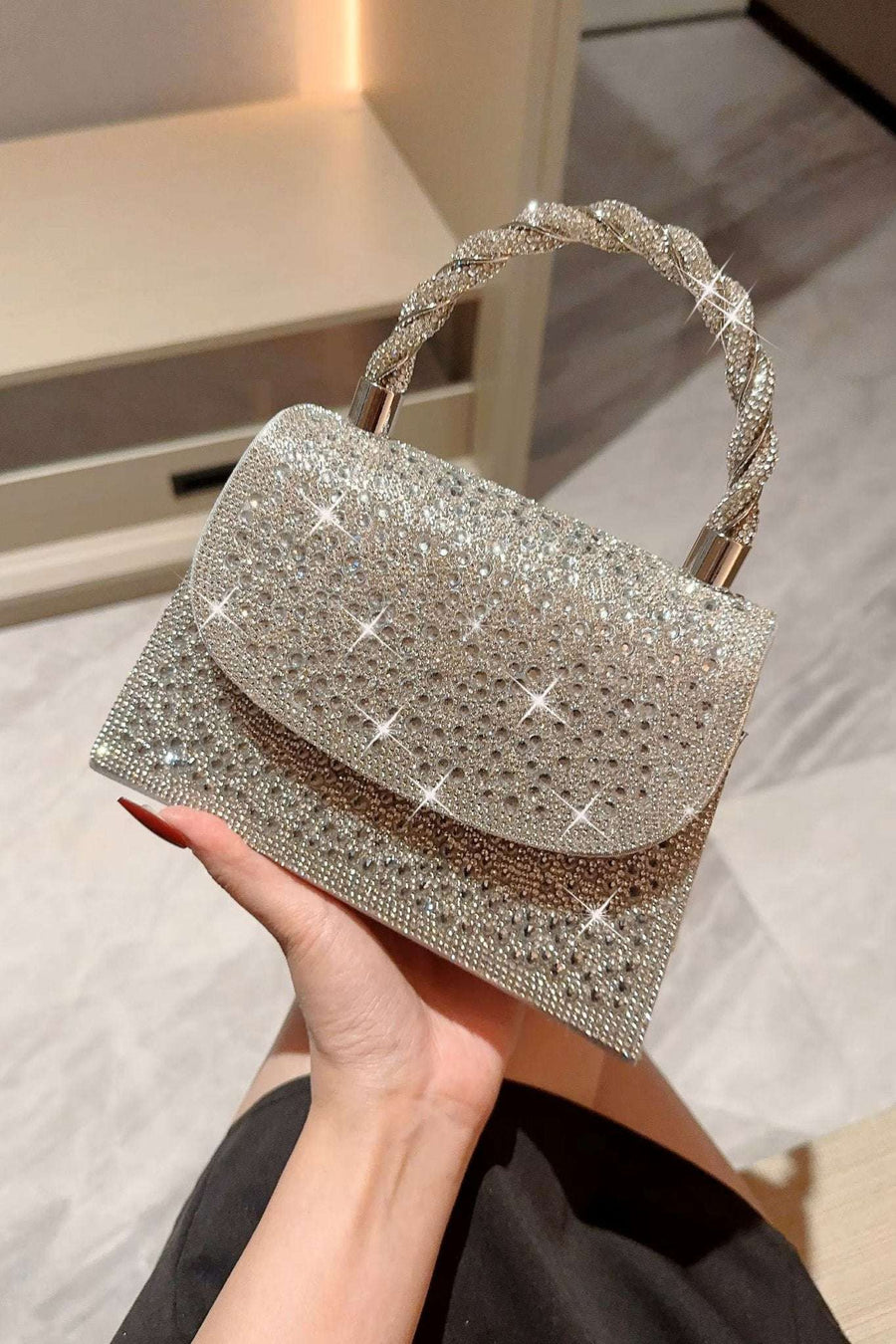 Silver Crystal studded clutch Bag with Rope Handle featuring shimmering rhinestones and a braided metallic handle, ideal for evening wear.
