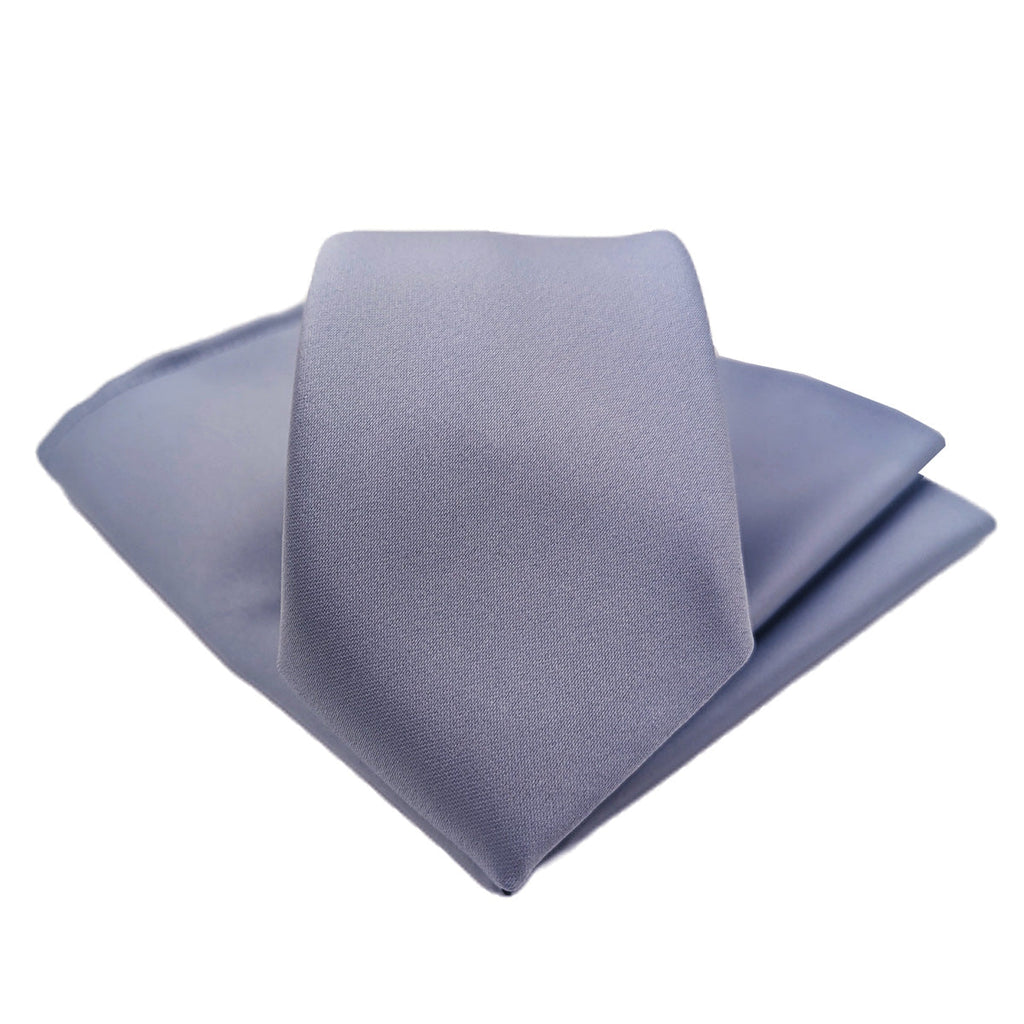 Smokey Blue Wedding Tie folded with matching pocket square, a versatile handmade accessory ideal for groomsmen or formal events.