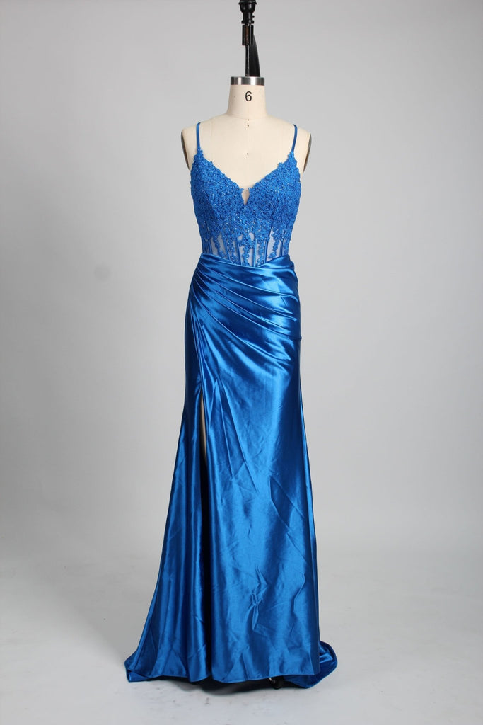 Blake Prom Dress in royal blue satin with corset bodice, mesh embroidery, and pleated skirt. Features a thigh-high slit and string tie back.
