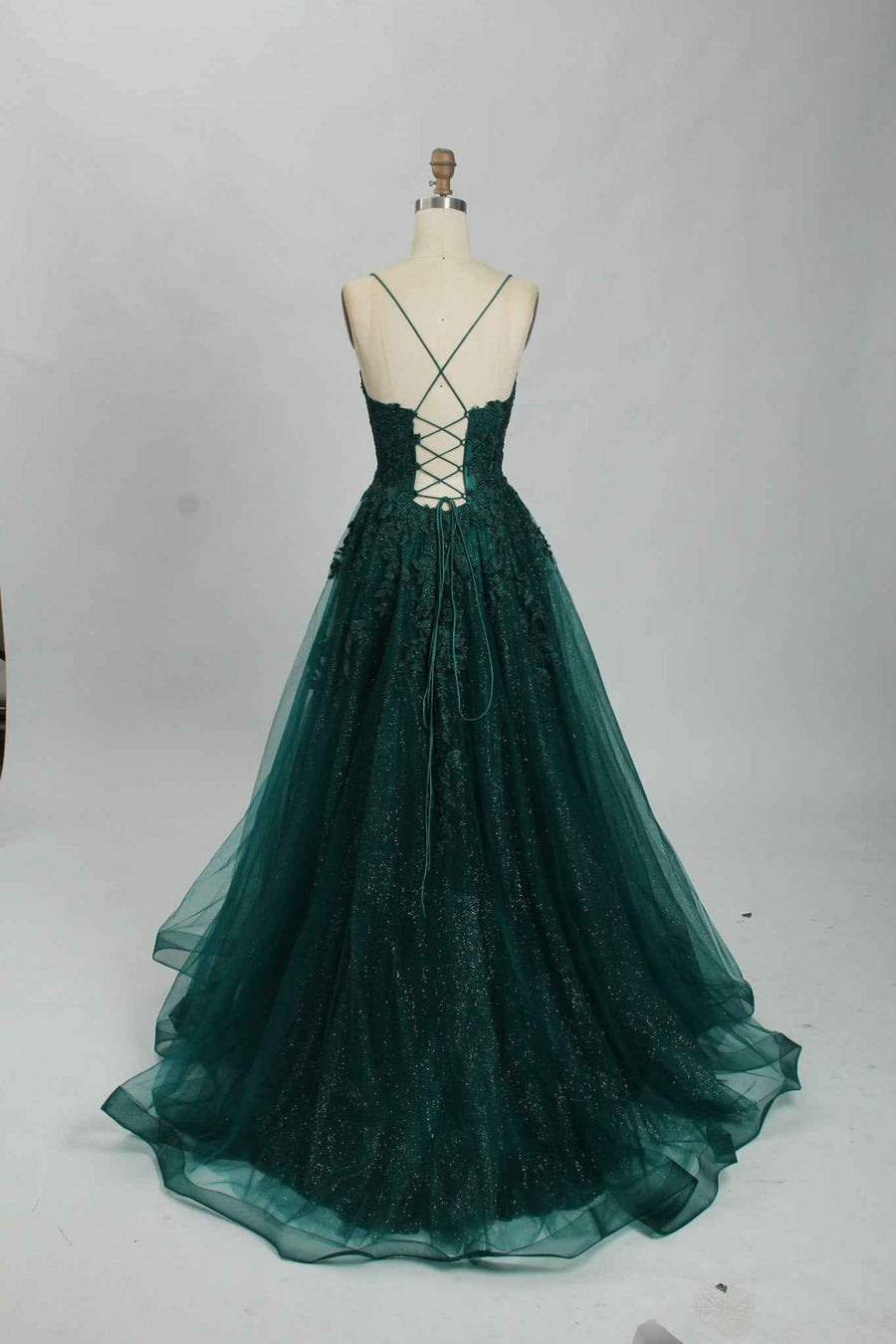 Back view of Joy Tulle Ballgown in deep green with glitter tulle and lace-up corset, ideal for prom or black-tie events.