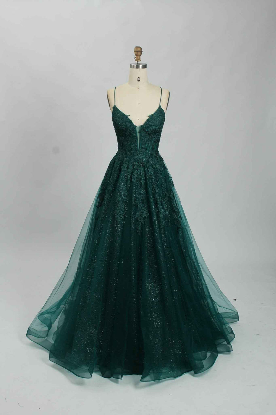 Joy Tulle Ballgown in deep green with floral applique and glitter tulle, ideal for prom or black tie events. Features a fitted corset bodice and full skirt.