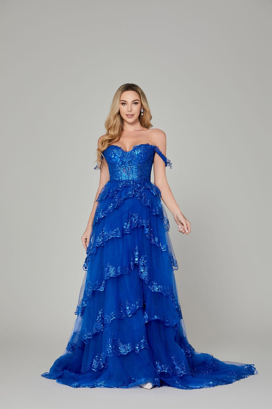Chloe Lilac Glitter Dress - Off-Shoulder Prom gown in royal blue with lace appliques, sequin embellishments, and tiered tulle skirt.