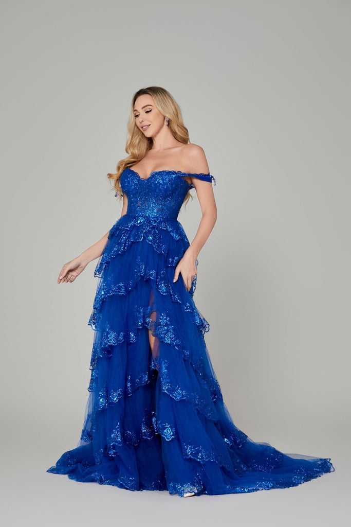 Chloe Royal Blue Prom Dress features an off-shoulder neckline, glittery lace bodice, and tiered sequin tulle skirt perfect for prom or formal events.