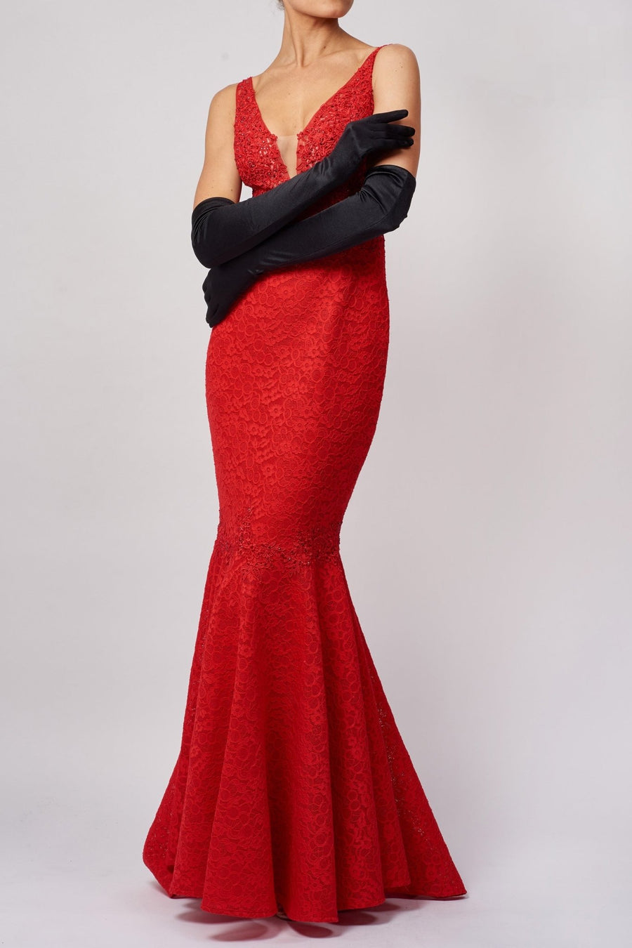 woman wearing a red formal gown and black satin opera gloves from Mascara London