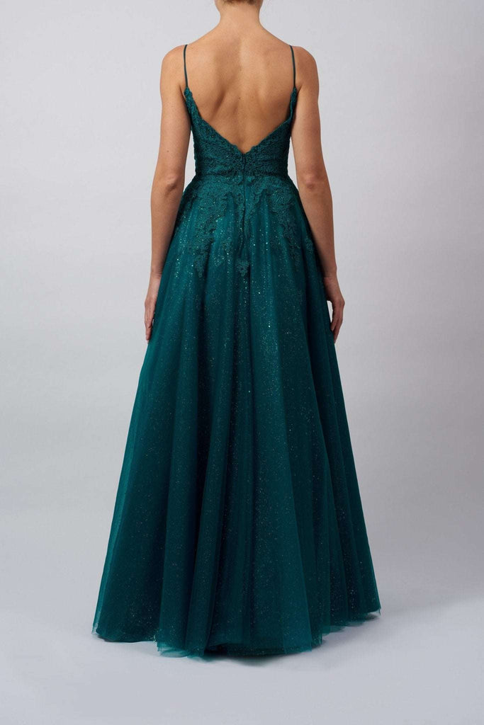 Back view of Mascara London Curve Collection MC511945 black glitter tulle ballgown with deep V-back and sparkling full-length skirt.
