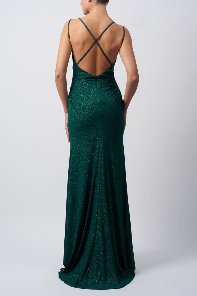 back view of lady wearing baby blue evening dress in stretch glitter fabric with rouching