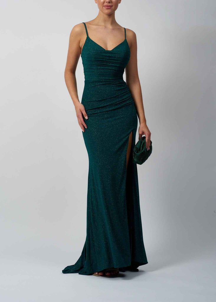 Image of a lady in a slim fitting green glitter long dress