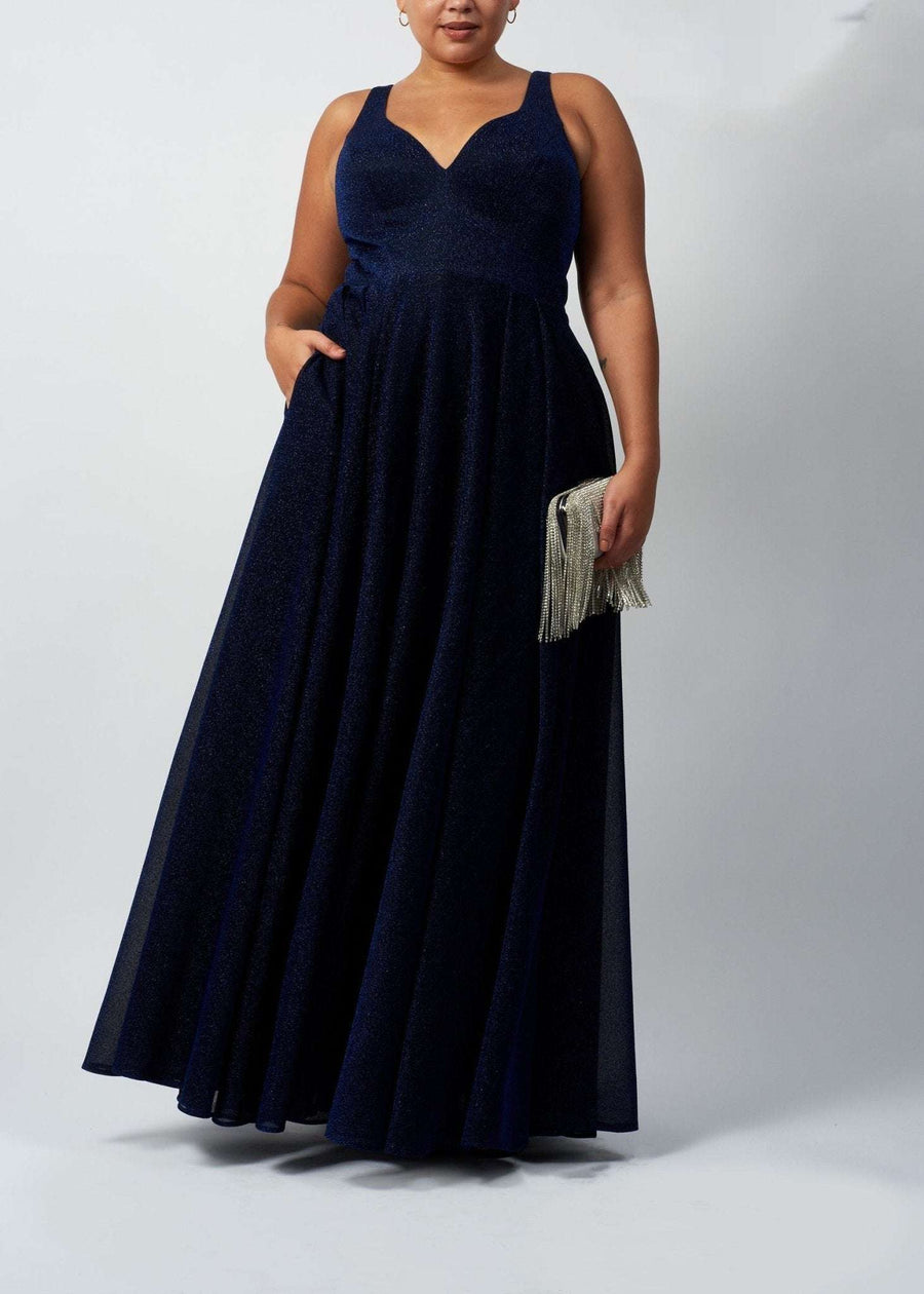 curvy lady wearing glitter navy prom dress