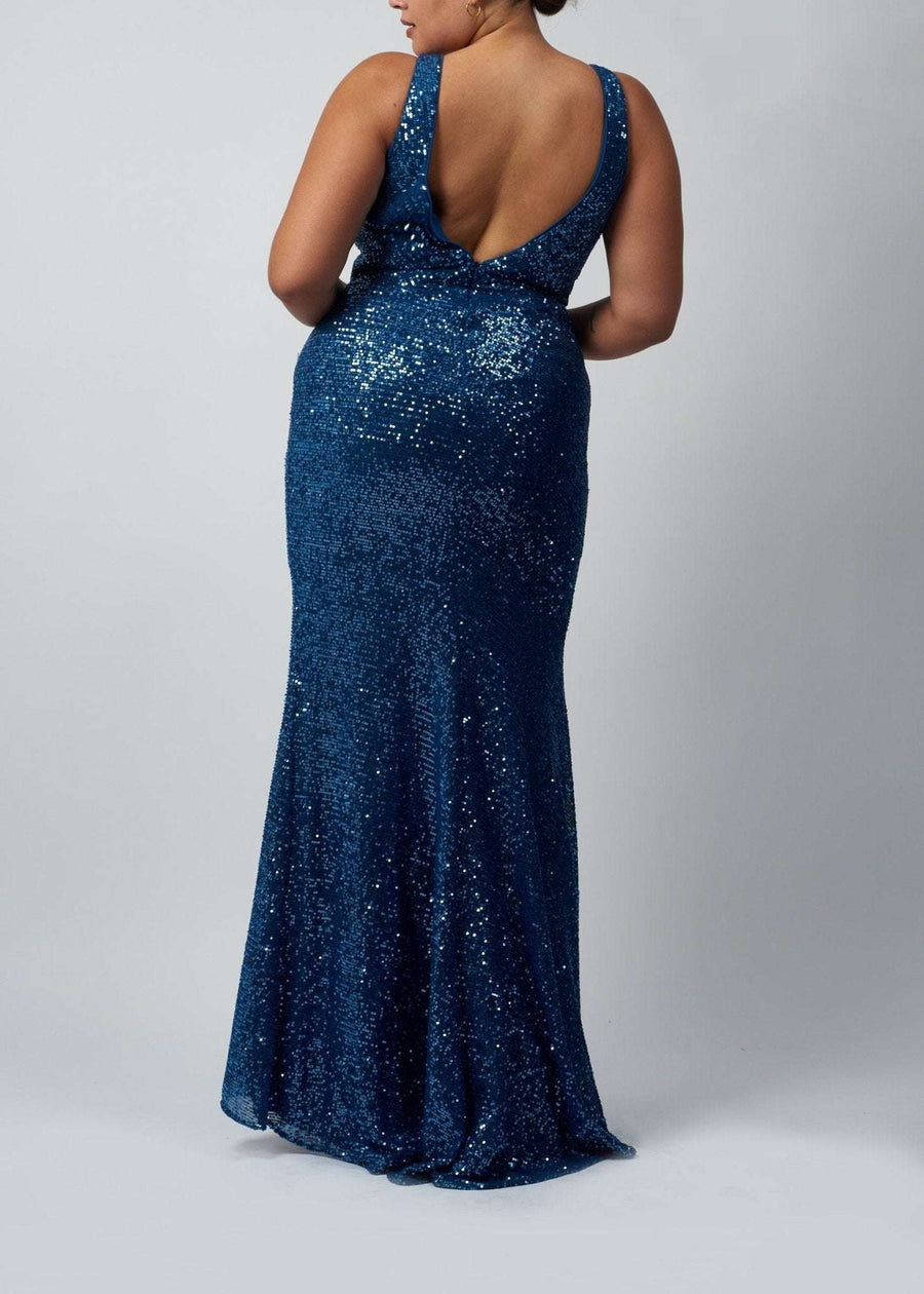 plus size lady wearing deep v back wrap full sequin dress in steele blue