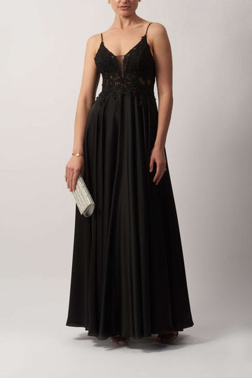 Young female standing in a Black Embroidered Satin Dress
