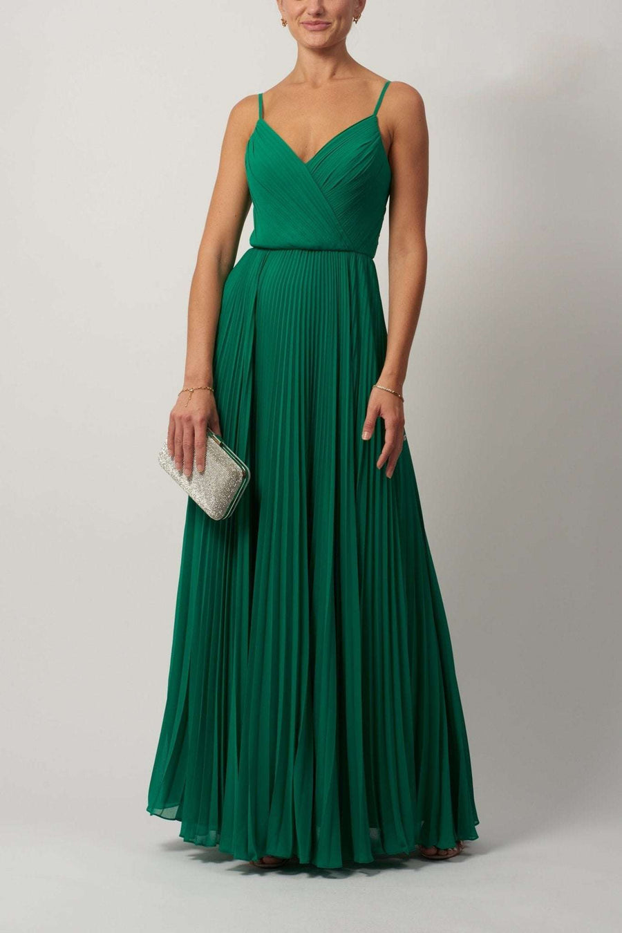 Young female standing in a Emerald Chiffon Dress