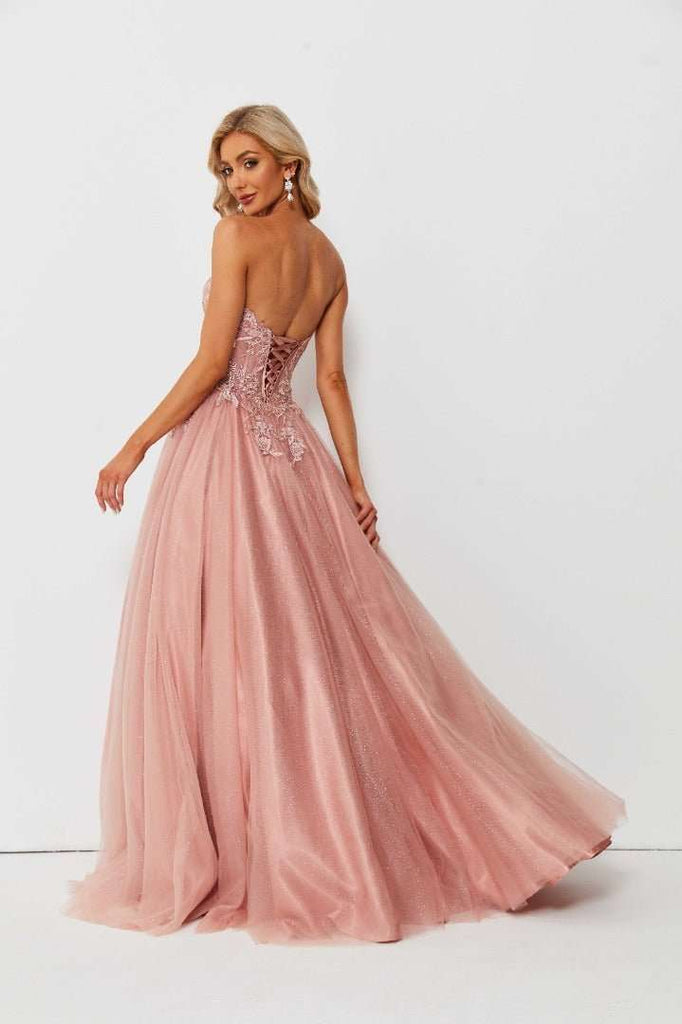 Back angle of pink sweetheart corset ballgown with lace-up detail and flowing glitter tulle skirt. Comparable to Leah Corset Ballgown silhouette.