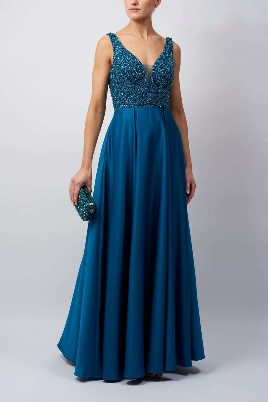 Young female standing in a Petrol Beaded Satin Dress