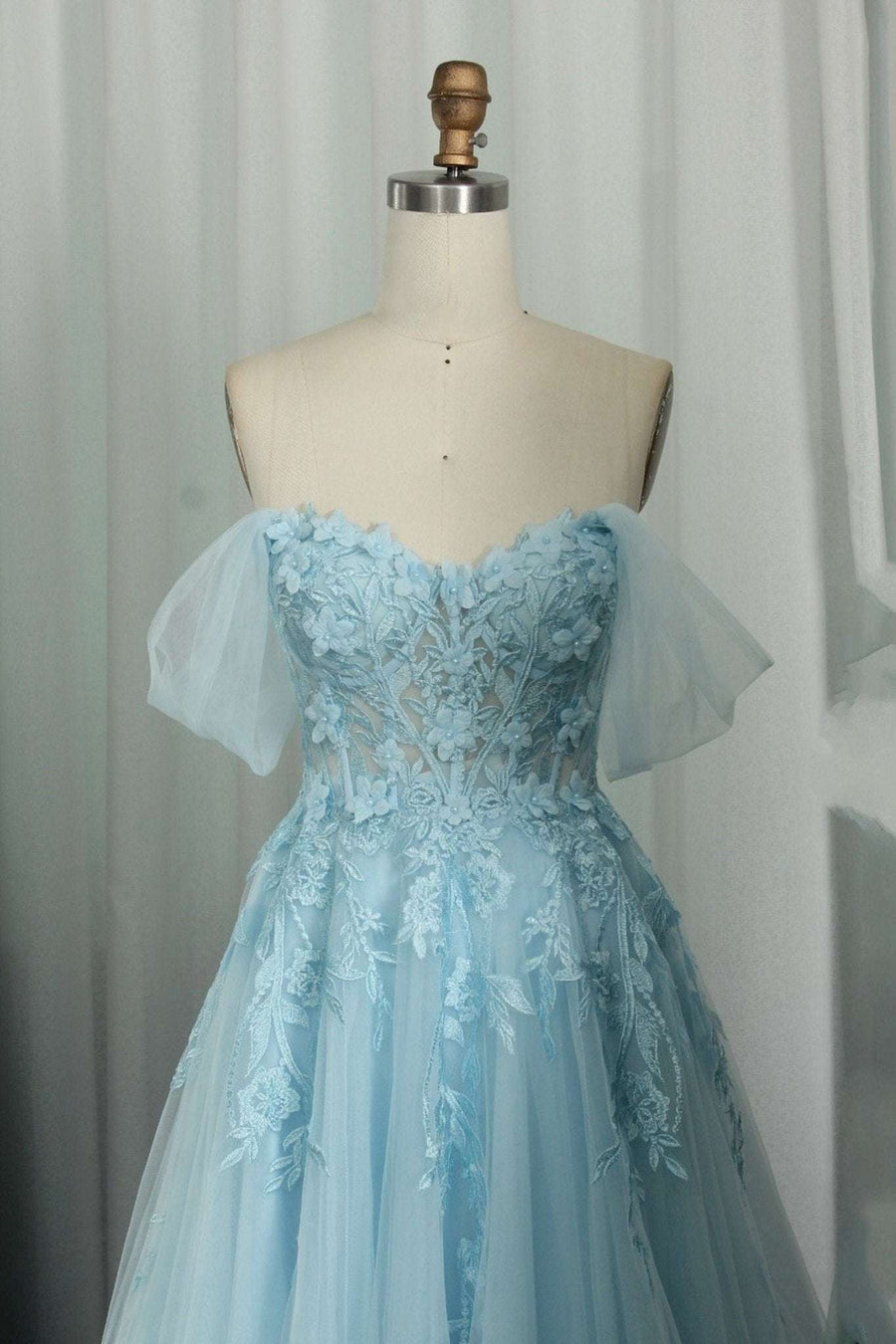 Baby Blue Corset Dress - Ylona features a strapless sweetheart neckline, lace bodice with 3D floral appliqués, and flowing tulle skirt. Ideal for prom or evening events.